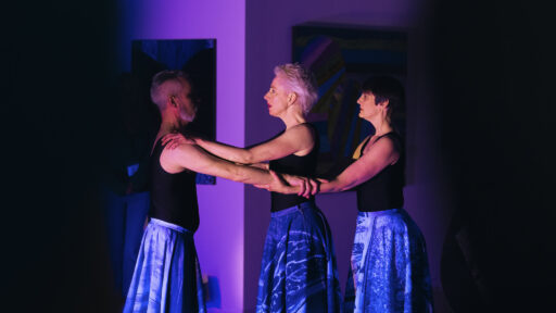 three people doing a performance