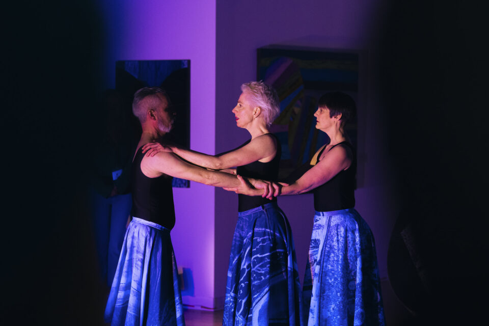 three people doing a performance