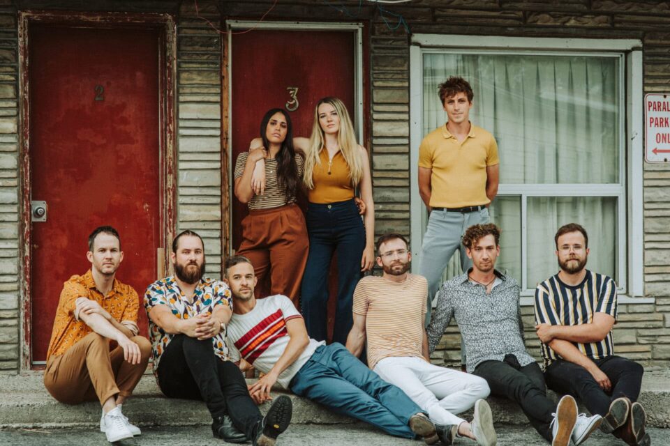 band posing infront of an old motel