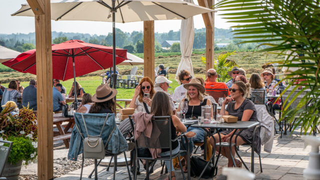 People enjoying the patio at Rolling Grape.