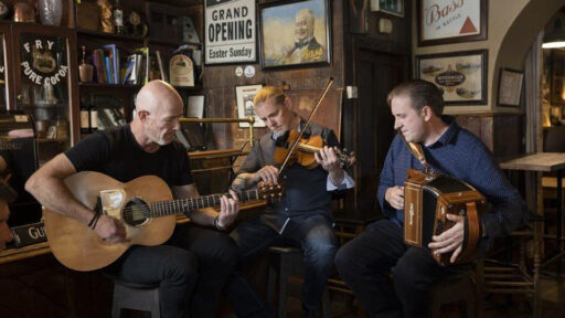 three men playing various intruments