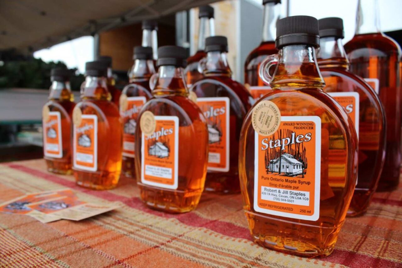 Rows of full maple syrup bottles